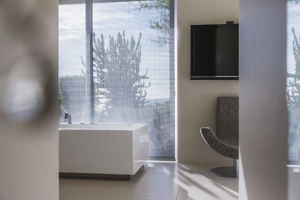 Sunscreens blocking direct sunlight from Scottsdale AZ and Boerne TX apartment