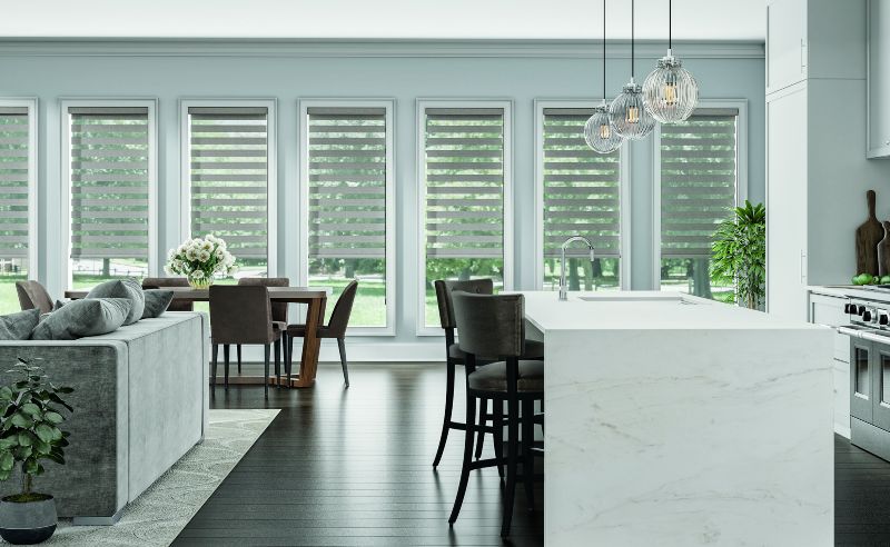 Banded shades span living and dining area in Scottsdale AZ and Boerne TX home